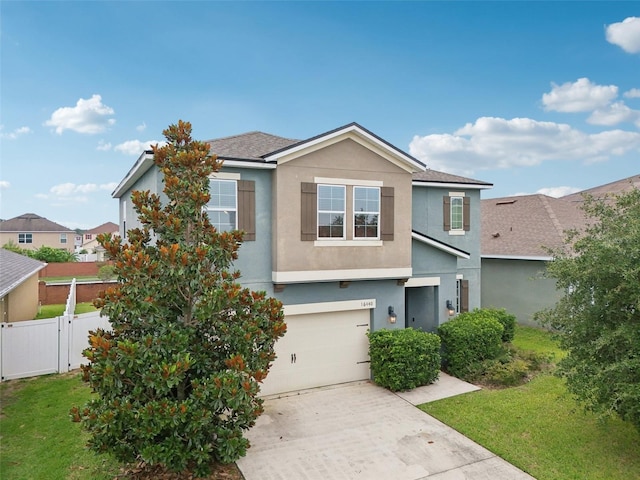 16440 Centipede St, Clermont, FL 34714 - traditional home featuring stucco siding, a garage, and driveway