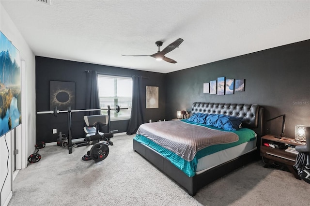 16440 Centipede St, Clermont, FL 34714 - carpeted bedroom with a ceiling fan and a textured ceiling