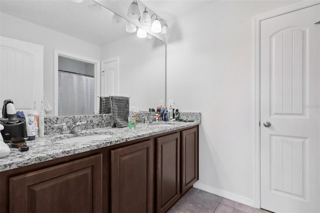 16440 Centipede St, Clermont, FL 34714 - full bath with double vanity and tile patterned flooring