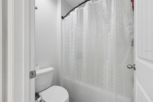 16440 Centipede St, Clermont, FL 34714 - bathroom with toilet and shower / bathtub combination with curtain