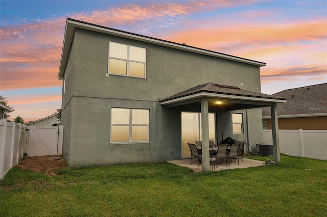 16440 Centipede St, Clermont, FL 34714 - rear view of house featuring a patio, a fenced backyard, stucco siding, and a gate