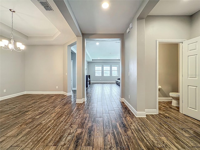 1540 Orange Valley Rdg, Ocoee, FL 34761 - hall with dark wood finished floors, baseboards, and a chandelier