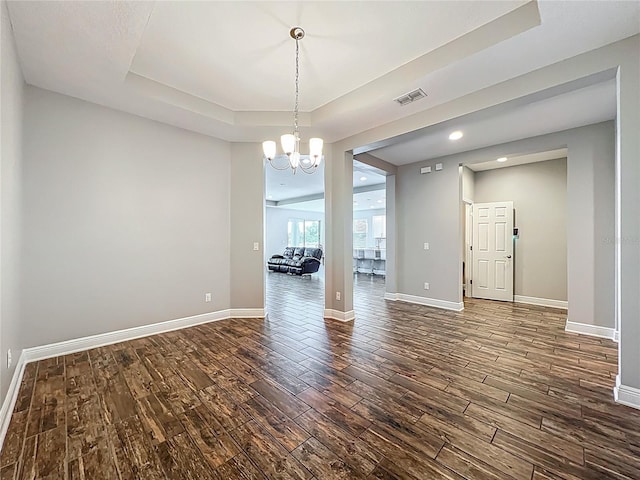 1540 Orange Valley Rdg, Ocoee, FL 34761 - spare room featuring dark wood finished floors, a tray ceiling, baseboards, a chandelier, and recessed lighting