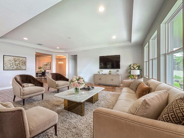 1540 Orange Valley Rdg, Ocoee, FL 34761 - living area featuring baseboards, a raised ceiling, and recessed lighting