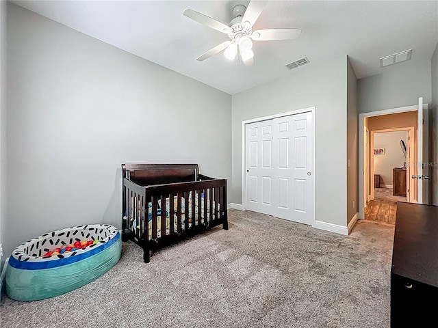 1540 Orange Valley Rdg, Ocoee, FL 34761 - carpeted bedroom featuring baseboards, a closet, a nursery area, and a ceiling fan