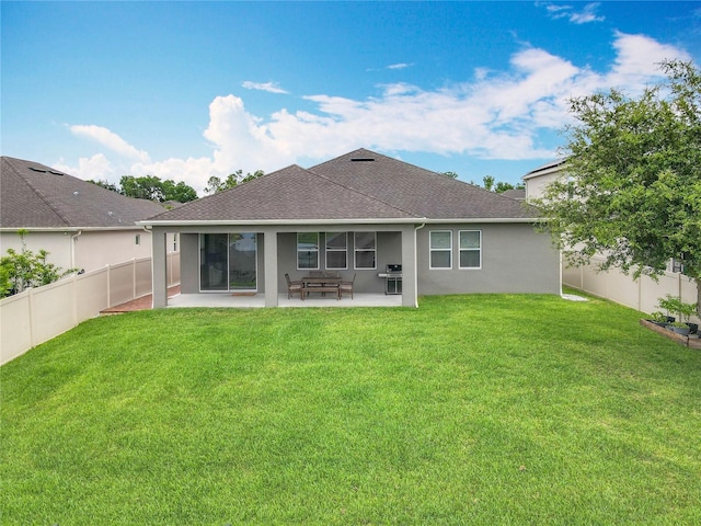 1540 Orange Valley Rdg, Ocoee, FL 34761 - rear view of house featuring a patio, stucco siding, and a shingled roof