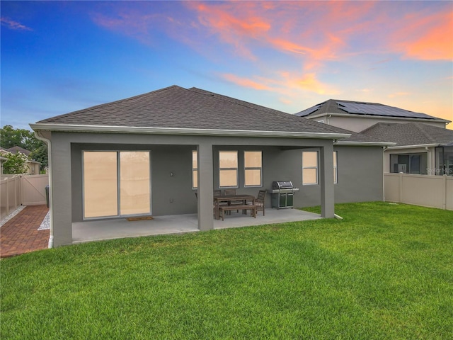 1540 Orange Valley Rdg, Ocoee, FL 34761 - rear view of property featuring roof with shingles, a patio, and stucco siding