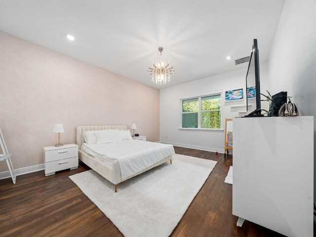 8085 Ludington Cir, Orlando, FL 32836 - bedroom featuring dark wood finished floors, a chandelier, and recessed lighting