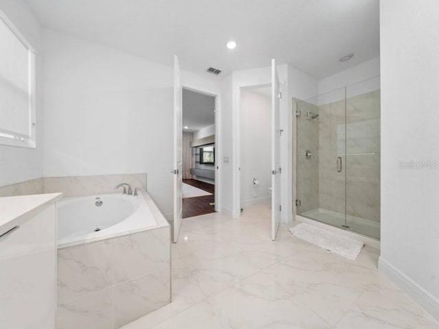 8085 Ludington Cir, Orlando, FL 32836 - full bathroom with a shower stall, a garden tub, marble finish flooring, and recessed lighting