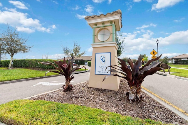8975 Fluffy Lie Ct, Davenport, FL 33896 - community sign with a yard
