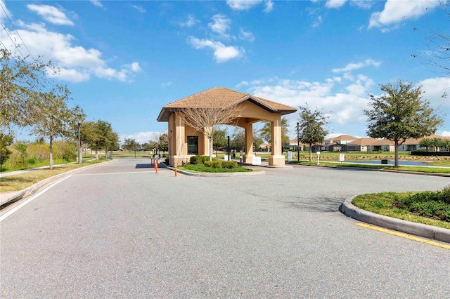 8975 Fluffy Lie Ct, Davenport, FL 33896 - view of asphalt street with curbs and sidewalks