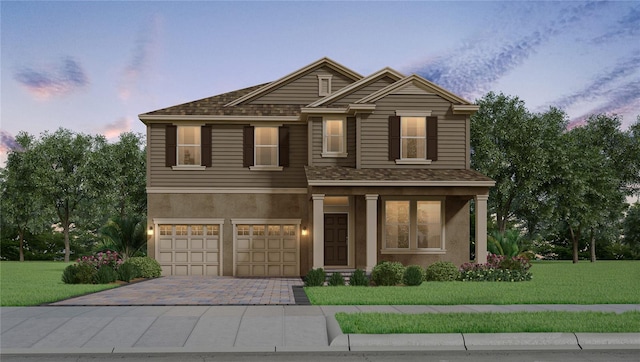 11063 Hollow Bay Dr, Winter Garden, FL 34787 - view of front facade featuring an attached garage, a front lawn, decorative driveway, stucco siding, and roof with shingles