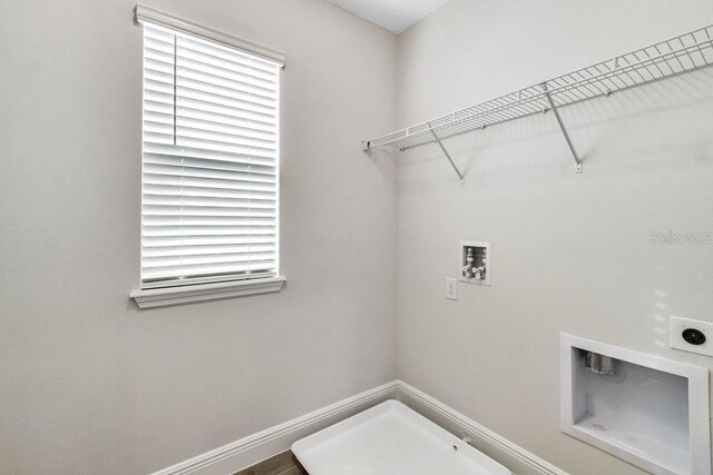 11063 Hollow Bay Dr, Winter Garden, FL 34787 - washroom featuring electric dryer hookup, washer hookup, and healthy amount of natural light