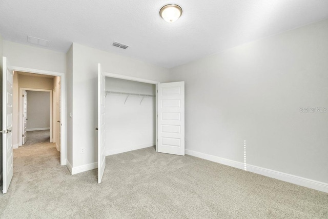 11063 Hollow Bay Dr, Winter Garden, FL 34787 - unfurnished bedroom featuring light carpet, a closet, and baseboards