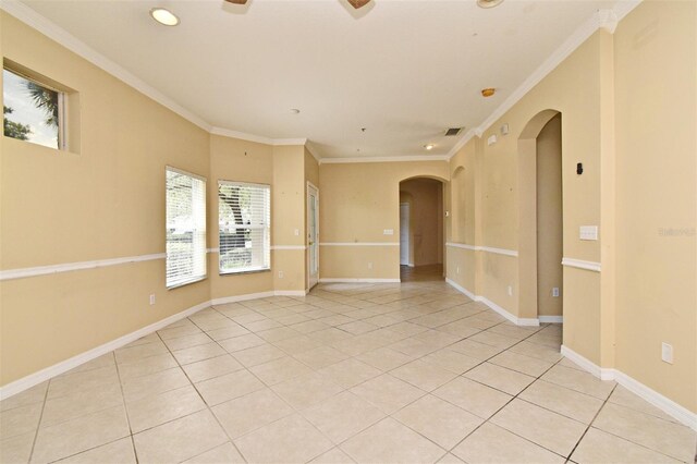 1086 Wickerwood St, Ocoee, FL 34761 - empty room featuring arched walkways, light tile patterned floors, ornamental molding, recessed lighting, and a ceiling fan