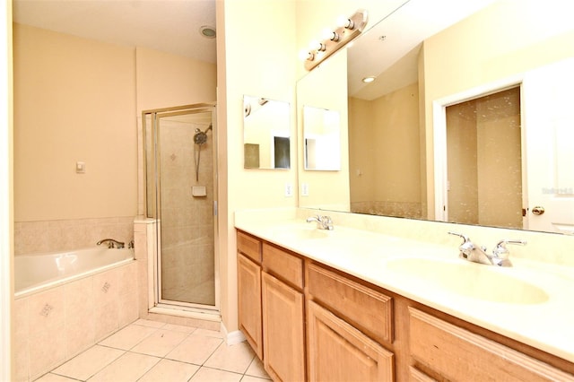 1086 Wickerwood St, Ocoee, FL 34761 - full bath featuring tile patterned floors, double vanity, a bath, and a shower stall