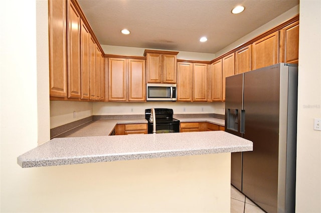 1086 Wickerwood St, Ocoee, FL 34761 - kitchen with appliances with stainless steel finishes, a peninsula, recessed lighting, light tile patterned floors, and light countertops