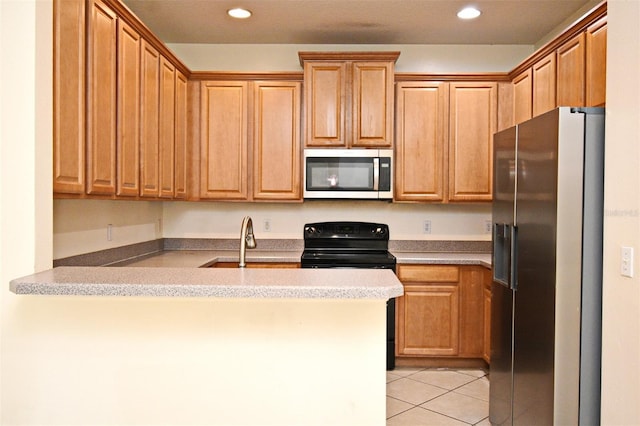 1086 Wickerwood St, Ocoee, FL 34761 - kitchen with stainless steel appliances, a peninsula, a sink, light tile patterned flooring, and recessed lighting