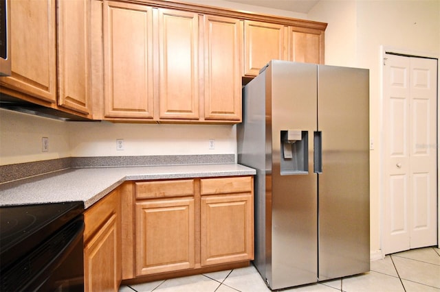 1086 Wickerwood St, Ocoee, FL 34761 - kitchen with stainless steel refrigerator with ice dispenser and light tile patterned floors