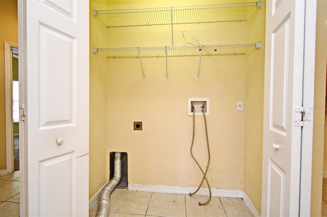 1086 Wickerwood St, Ocoee, FL 34761 - washroom featuring electric dryer hookup, light tile patterned flooring, washer hookup, and baseboards