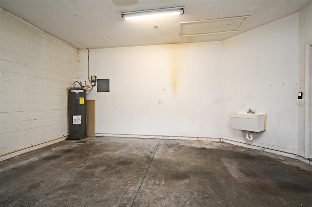 1086 Wickerwood St, Ocoee, FL 34761 - garage with electric water heater, a sink, and concrete block wall
