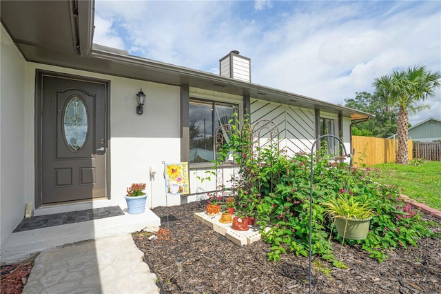 2112 Plymouth Sorrento Rd, Apopka, FL 32712 - entrance to property with a chimney and stucco siding