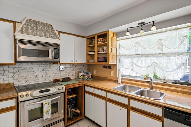 2112 Plymouth Sorrento Rd, Apopka, FL 32712 - kitchen featuring stainless steel appliances, a sink, white cabinetry, and decorative backsplash