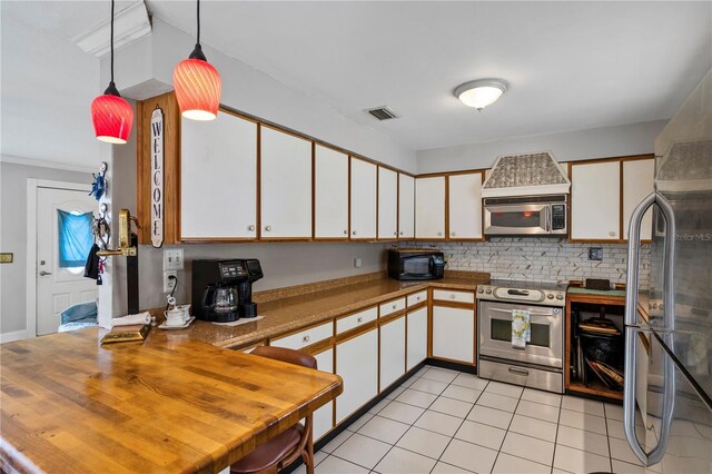 2112 Plymouth Sorrento Rd, Apopka, FL 32712 - kitchen featuring stainless steel appliances, white cabinets, and backsplash