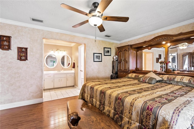 2112 Plymouth Sorrento Rd, Apopka, FL 32712 - bedroom featuring light wood finished floors, a textured ceiling, crown molding, baseboards, and ceiling fan