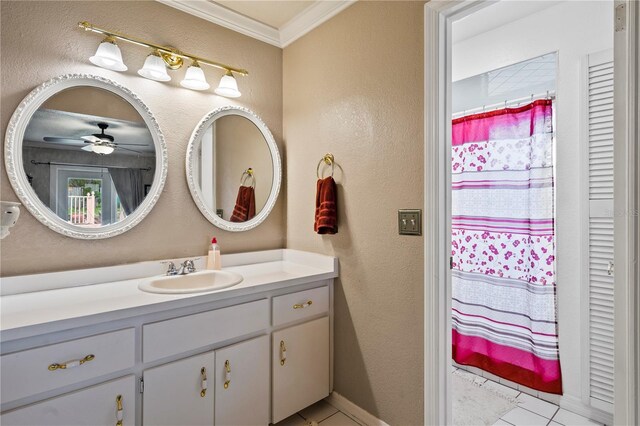 2112 Plymouth Sorrento Rd, Apopka, FL 32712 - full bath with ornamental molding, a textured wall, vanity, a ceiling fan, and tile patterned flooring