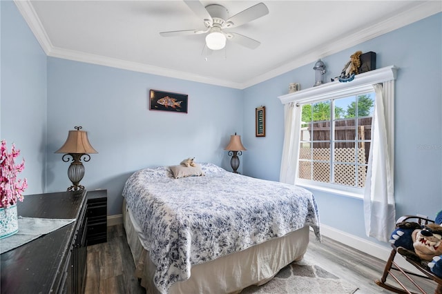 2112 Plymouth Sorrento Rd, Apopka, FL 32712 - bedroom featuring ornamental molding, dark wood-style floors, baseboards, and a ceiling fan