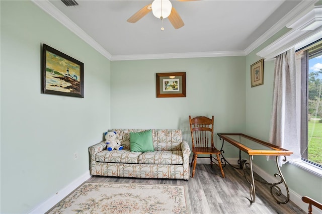 2112 Plymouth Sorrento Rd, Apopka, FL 32712 - sitting room featuring plenty of natural light, crown molding, baseboards, wood finished floors, and ceiling fan