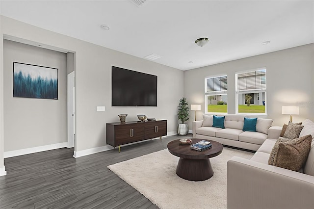2311 Bear Peak Rd, Clermont, FL 34715 - living area featuring dark wood-style floors and baseboards