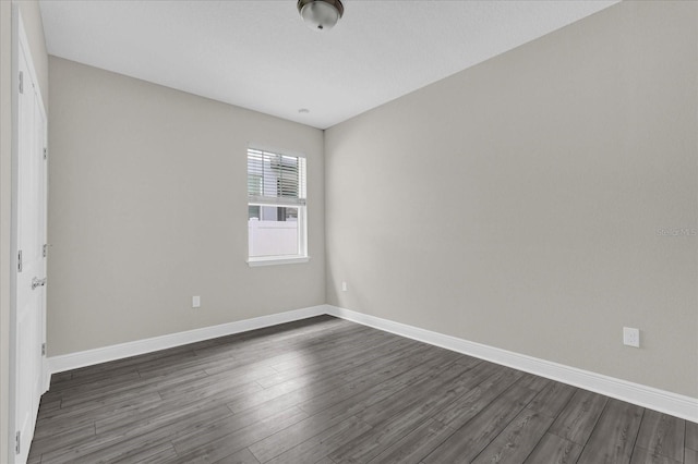 2311 Bear Peak Rd, Clermont, FL 34715 - spare room featuring dark wood finished floors