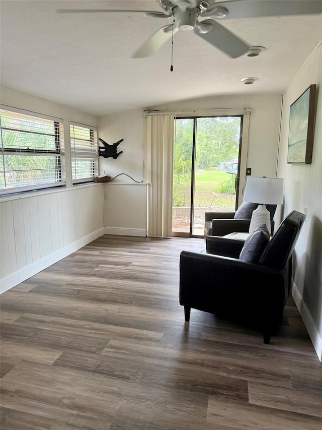 10301 US Highway 27 Unit 34, Clermont, FL 34711 - living area with baseboards, a ceiling fan, and wood finished floors