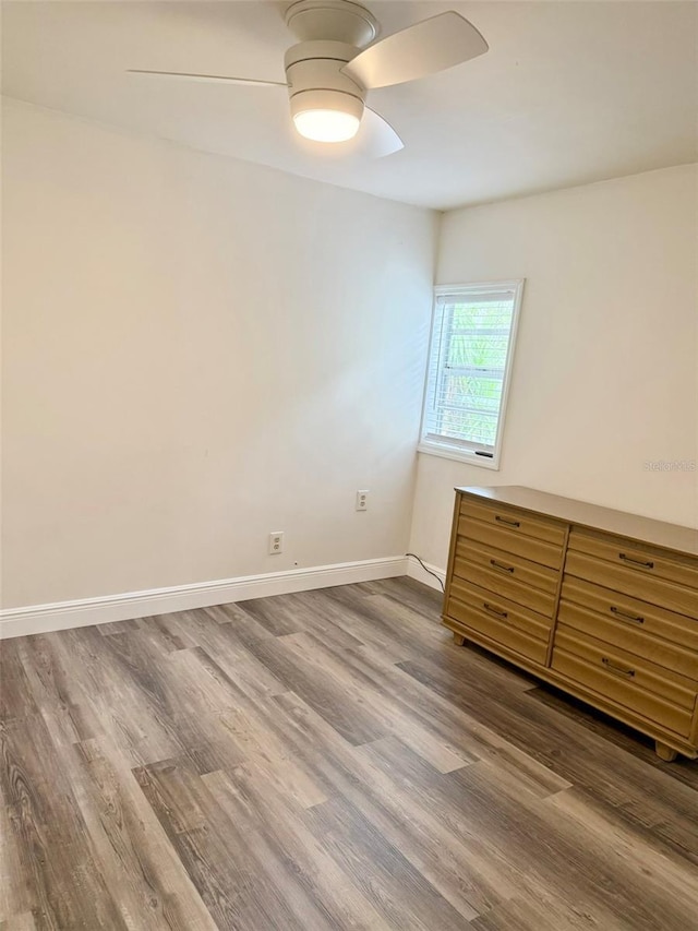 10301 US Highway 27 Unit 34, Clermont, FL 34711 - spare room with ceiling fan, wood finished floors, and baseboards
