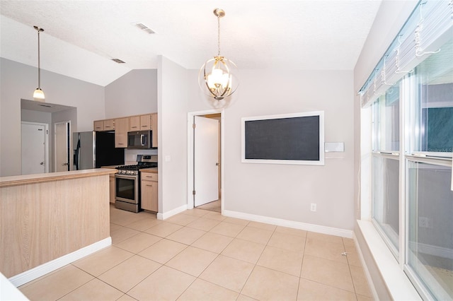 1115 Marni Ridge Ct, Kissimmee, FL 34747 - kitchen with stainless steel appliances, vaulted ceiling, light brown cabinetry, a chandelier, and light tile patterned floors