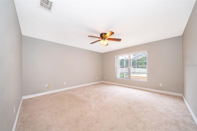 1115 Marni Ridge Ct, Kissimmee, FL 34747 - spare room with light carpet, baseboards, and ceiling fan
