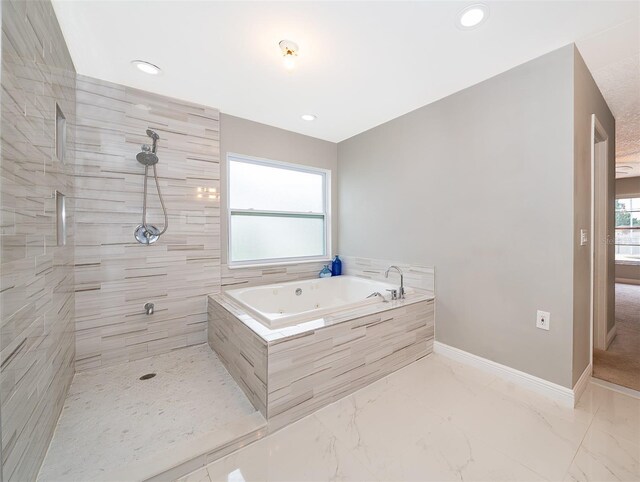 1115 Marni Ridge Ct, Kissimmee, FL 34747 - bathroom featuring a tub with jets, a tile shower, baseboards, recessed lighting, and marble finish floors