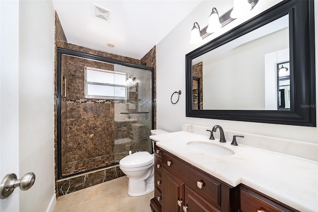 1115 Marni Ridge Ct, Kissimmee, FL 34747 - full bath with vanity, toilet, a shower stall, baseboards, and tile patterned floors