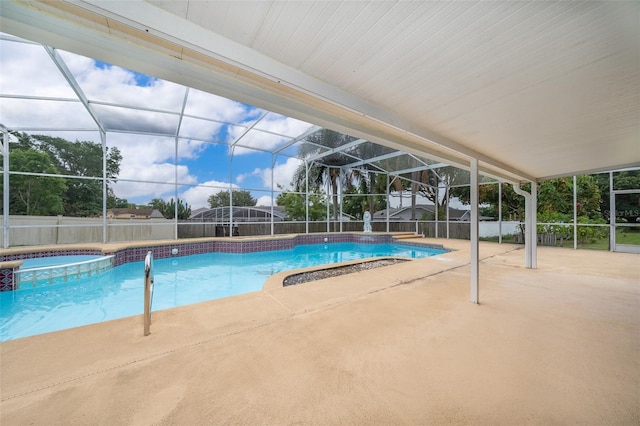 1115 Marni Ridge Ct, Kissimmee, FL 34747 - view of swimming pool with a patio area, a pool with connected hot tub, glass enclosure, and a fenced backyard