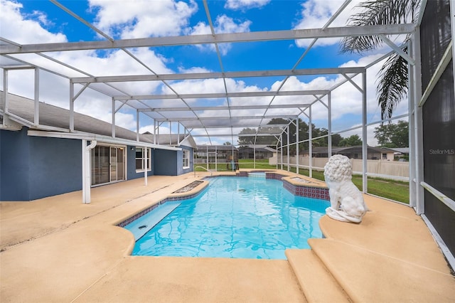 1115 Marni Ridge Ct, Kissimmee, FL 34747 - view of swimming pool featuring a patio area and glass enclosure