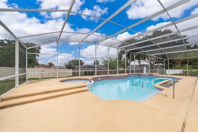 1115 Marni Ridge Ct, Kissimmee, FL 34747 - view of pool with a pool with connected hot tub, a patio, a fenced backyard, and a lanai
