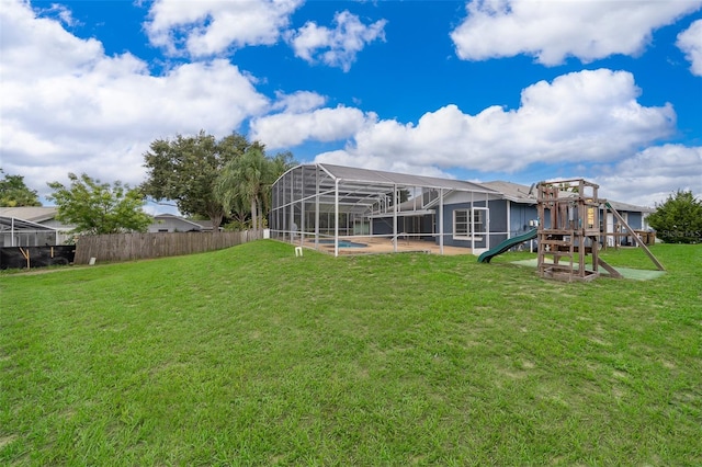 1115 Marni Ridge Ct, Kissimmee, FL 34747 - rear view of house featuring a playground, an outdoor pool, and a lanai