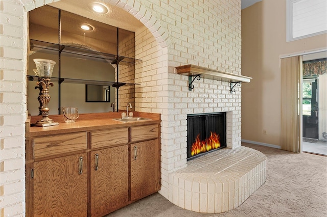 154 Golf Club Dr Unit 154, Longwood, FL 32779 - indoor wet bar featuring light colored carpet, a fireplace, and a high ceiling