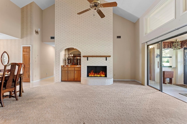 154 Golf Club Dr Unit 154, Longwood, FL 32779 - living room featuring high vaulted ceiling, a ceiling fan, carpet floors, a brick fireplace, and arched walkways