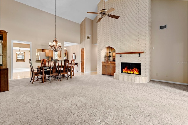 154 Golf Club Dr Unit 154, Longwood, FL 32779 - dining room featuring high vaulted ceiling, light colored carpet, a chandelier, a ceiling fan, and a brick fireplace