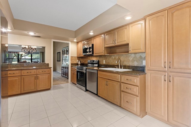 154 Golf Club Dr Unit 154, Longwood, FL 32779 - kitchen with stainless steel appliances, a chandelier, light tile patterned flooring, tasteful backsplash, and recessed lighting
