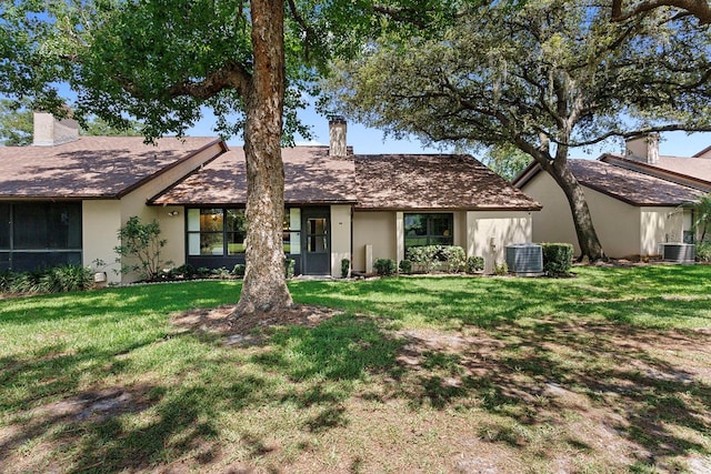 154 Golf Club Dr Unit 154, Longwood, FL 32779 - view of front of property with a chimney, stucco siding, and a front yard