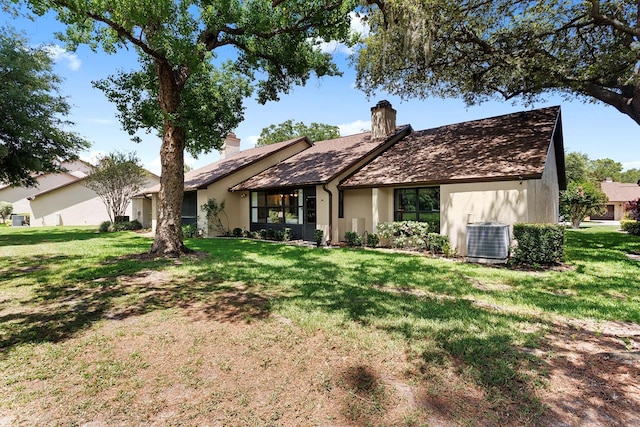 154 Golf Club Dr Unit 154, Longwood, FL 32779 - view of front of property featuring a chimney, a front lawn, and stucco siding